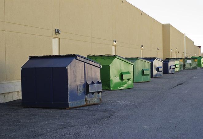 construction dumpsters on a worksite surrounded by caution tape in Corinth MS